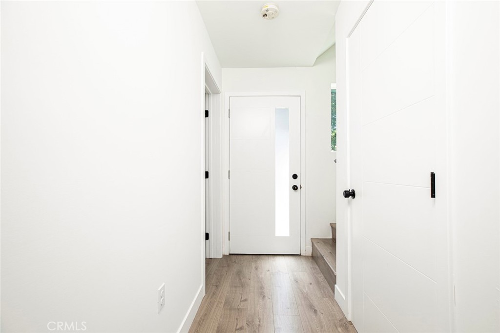 1843 West 20th Street Los Angeles, CA 90007 - Photo 3 of 38 a view of a hallway with wooden floor