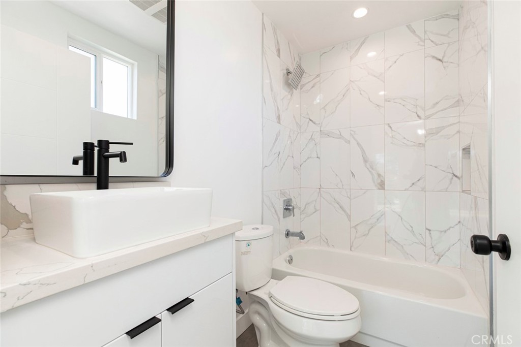 1843 West 20th Street Los Angeles, CA 90007 - Photo 32 of 38 a bathroom with a sink a toilet and a bathtub