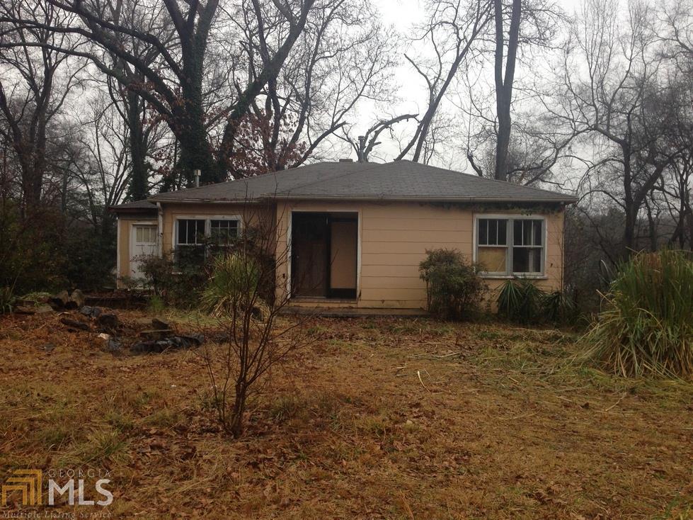 9724 Lavonia Road Carnesville, GA 30521 - Photo 1 of 1 a house that has a tree in front of it
