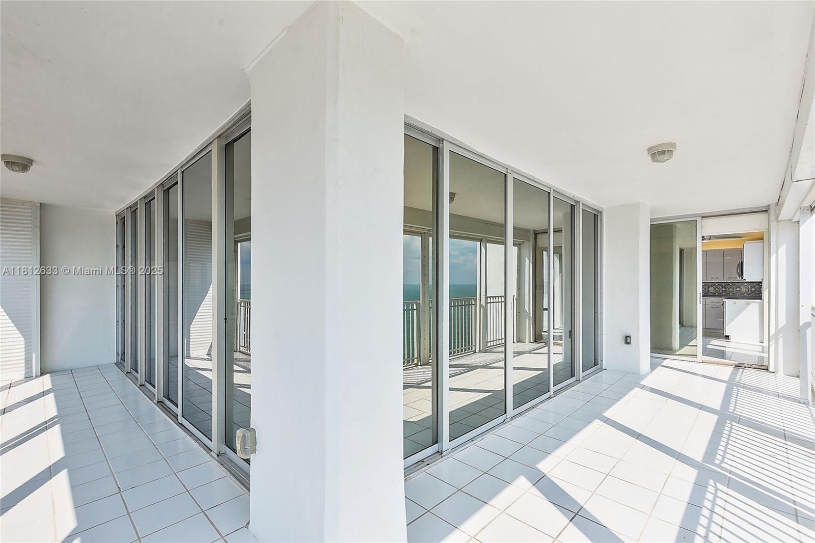 881 Ocean Drive, Unit 22A Key Biscayne, FL 33149 - Photo 23 of 26 a view of a room with windows