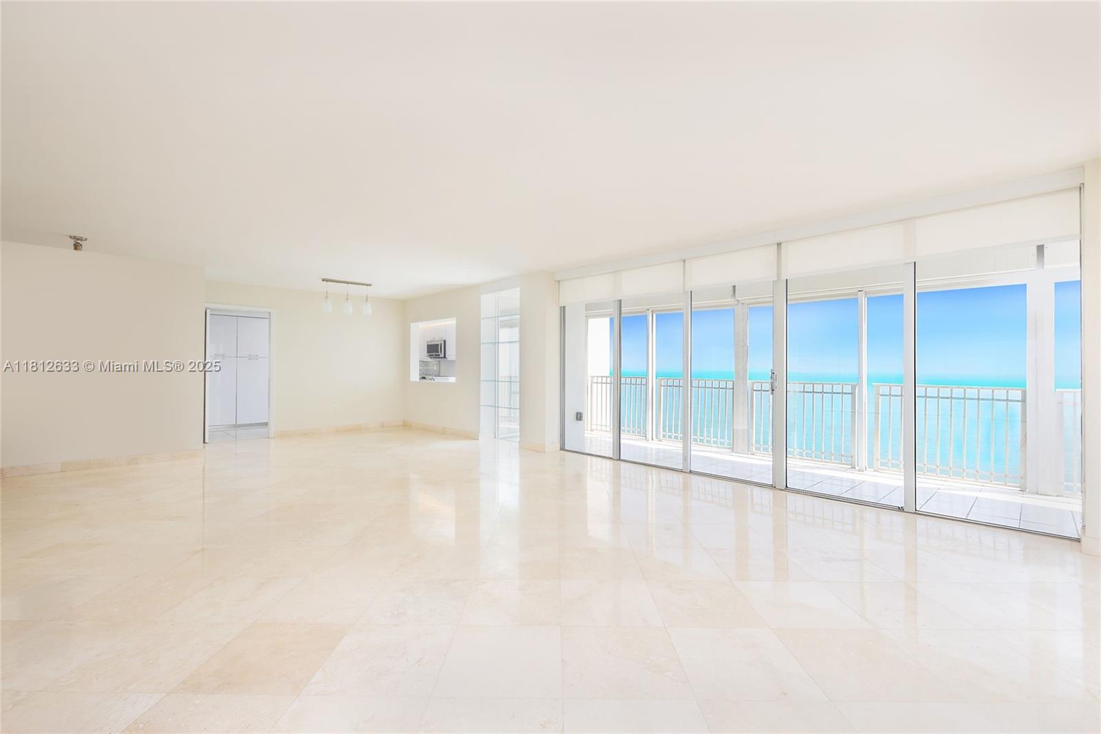 881 Ocean Drive, Unit 22A Key Biscayne, FL 33149 - Photo 3 of 26 an empty room with a empty space and windows