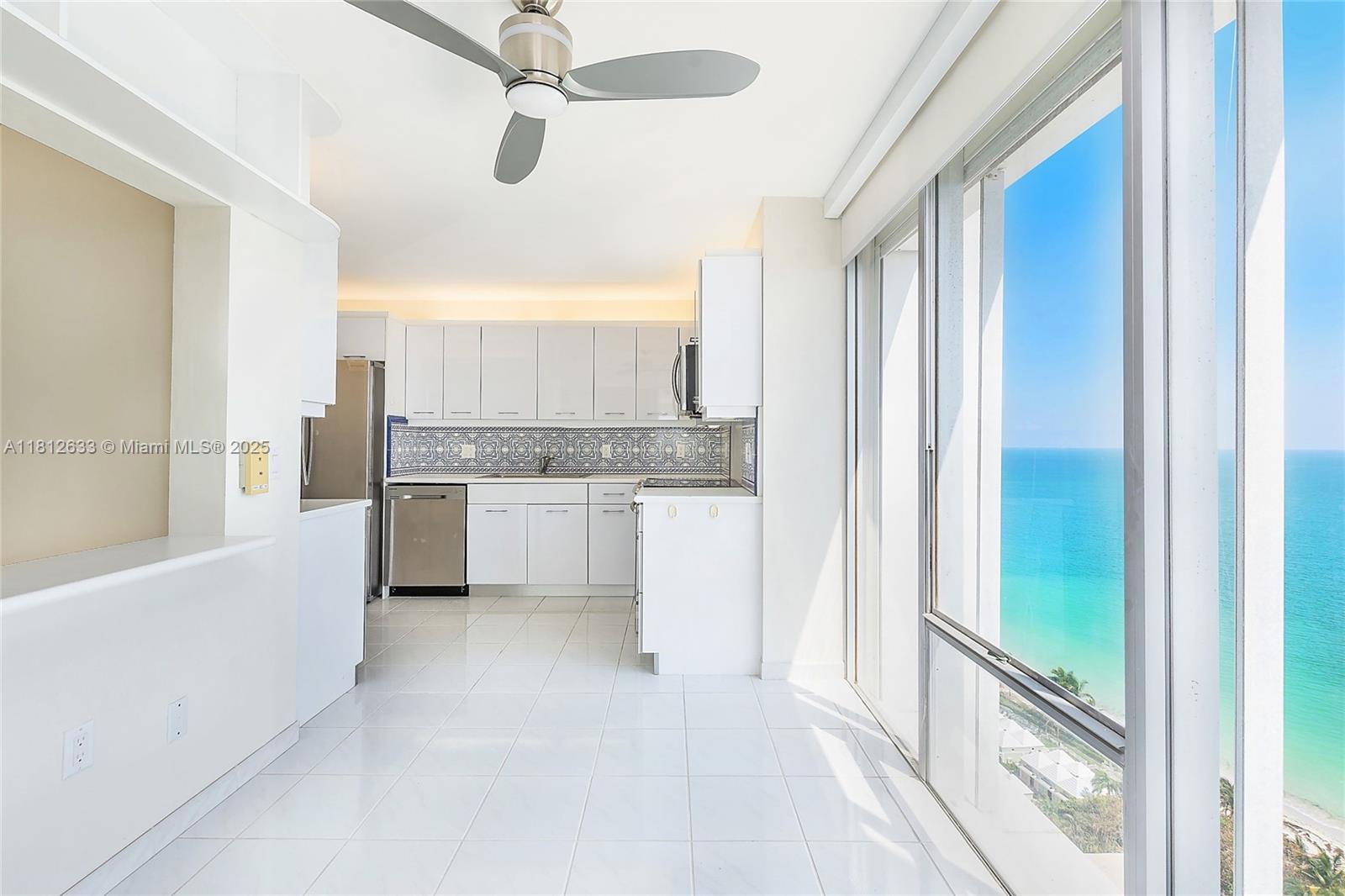 881 Ocean Drive, Unit 22A Key Biscayne, FL 33149 - Photo 7 of 26 a view of a kitchen with a sink and cabinet