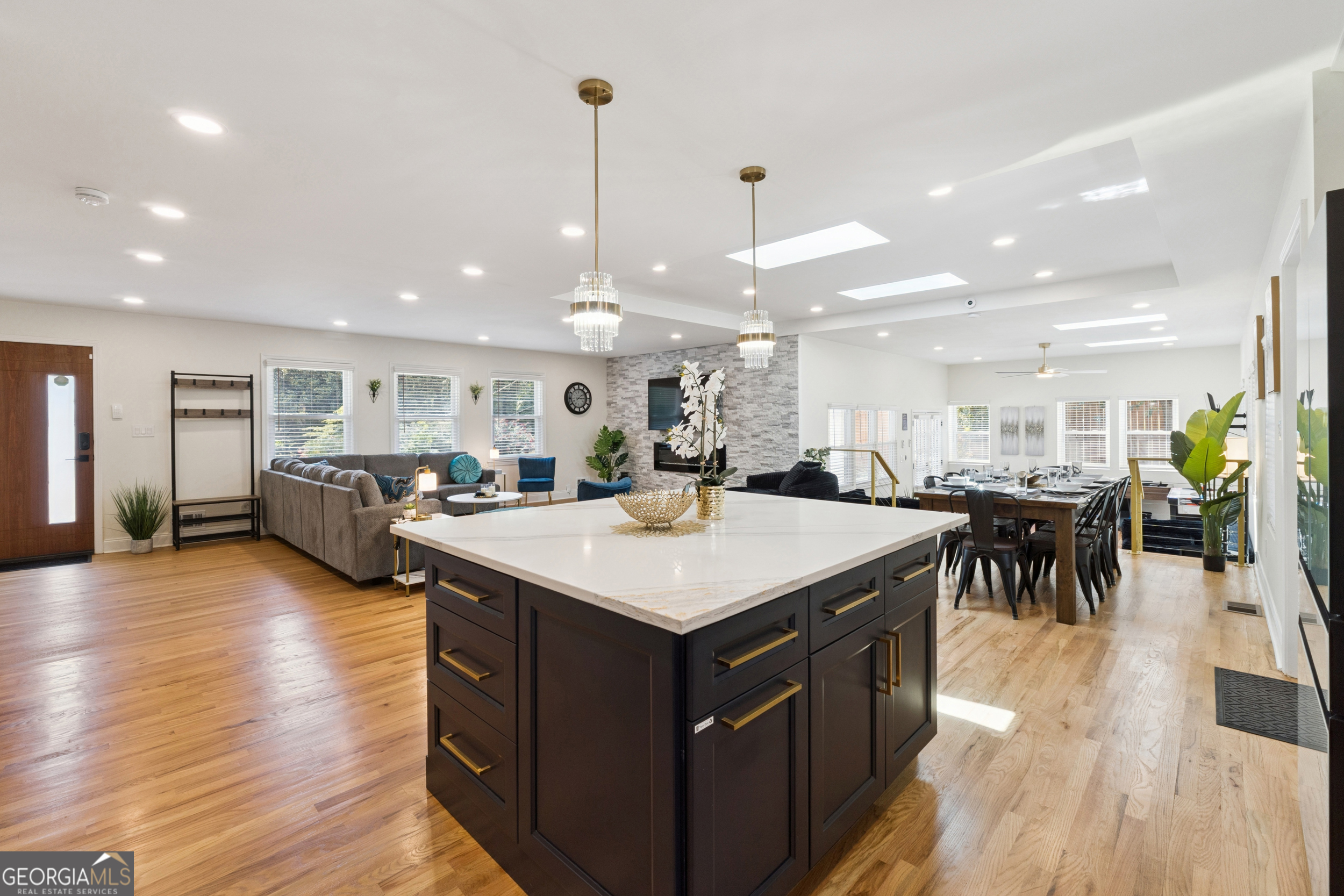 2139 Cedarbrook Court Southeast Atlanta, GA 30316 - Photo 19 of 69 a large kitchen with lots of counter space a sink appliances and a dining table