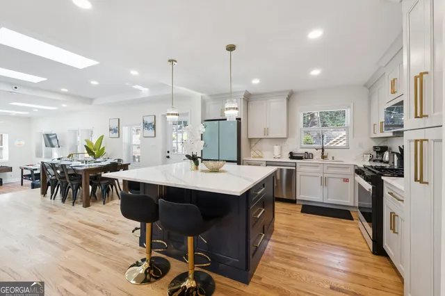 a bathroom with a double vanity sink toilet and a mirror