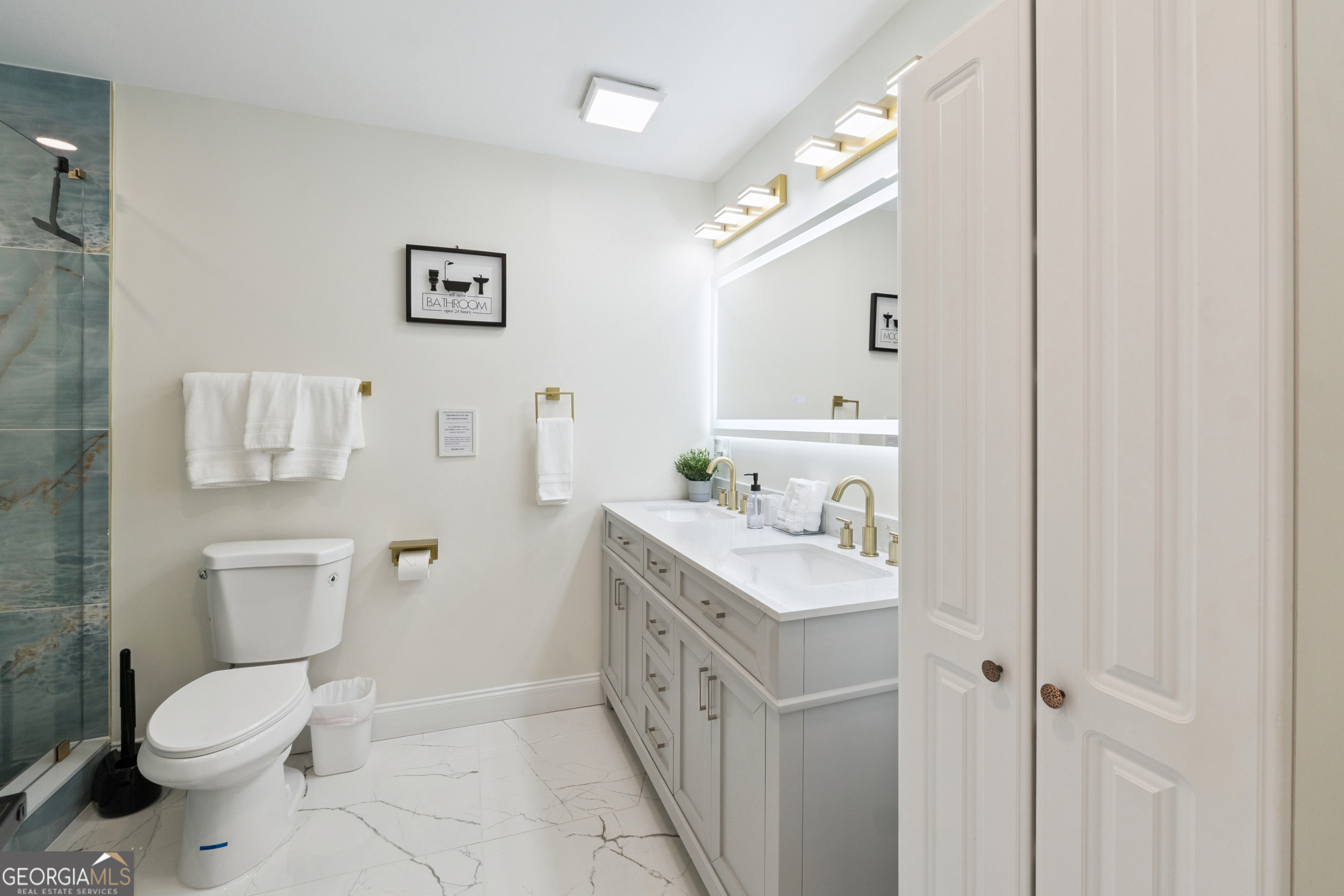 2139 Cedarbrook Court Southeast Atlanta, GA 30316 - Photo 29 of 69 a bathroom with a double vanity sink toilet and a mirror