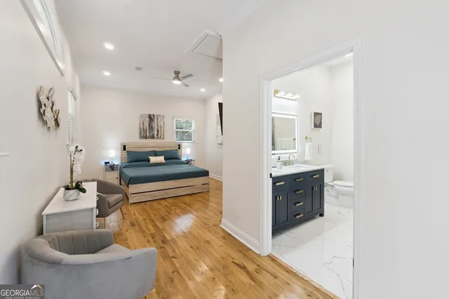 a view of staircase with wooden floor and a potted plant