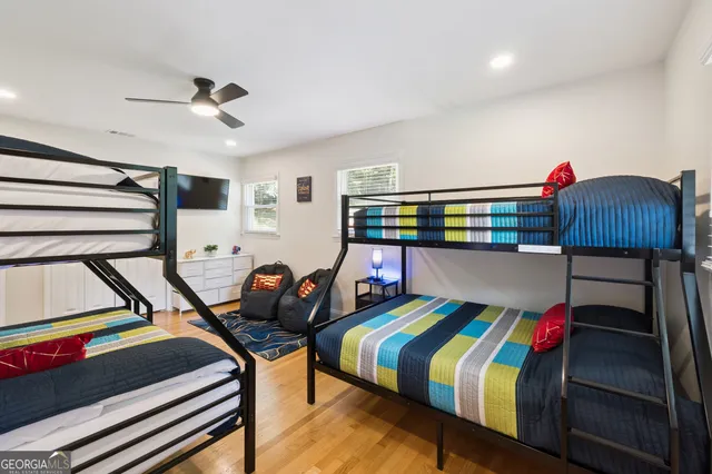 a view of a patio with couches and table with wooden floor
