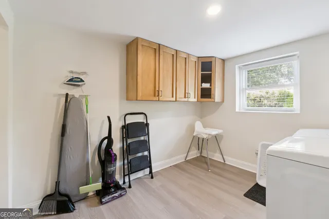 an aerial view of a house with backyard and outdoor seating