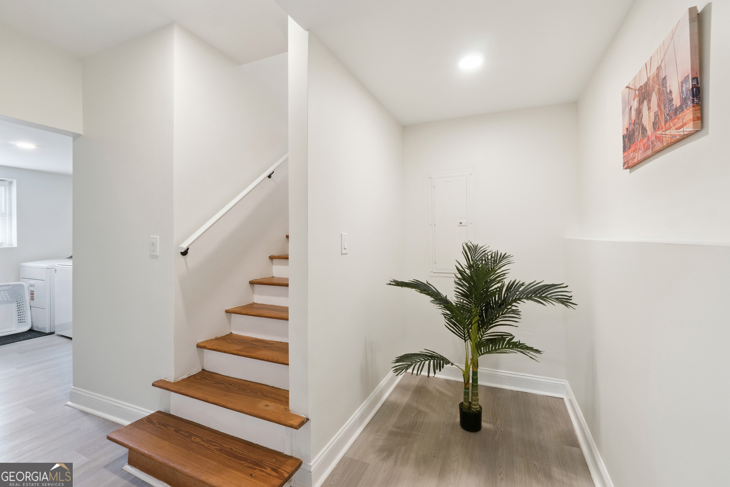 2139 Cedarbrook Court Southeast Atlanta, GA 30316 - Photo 49 of 69 a view of staircase with wooden floor and a potted plant