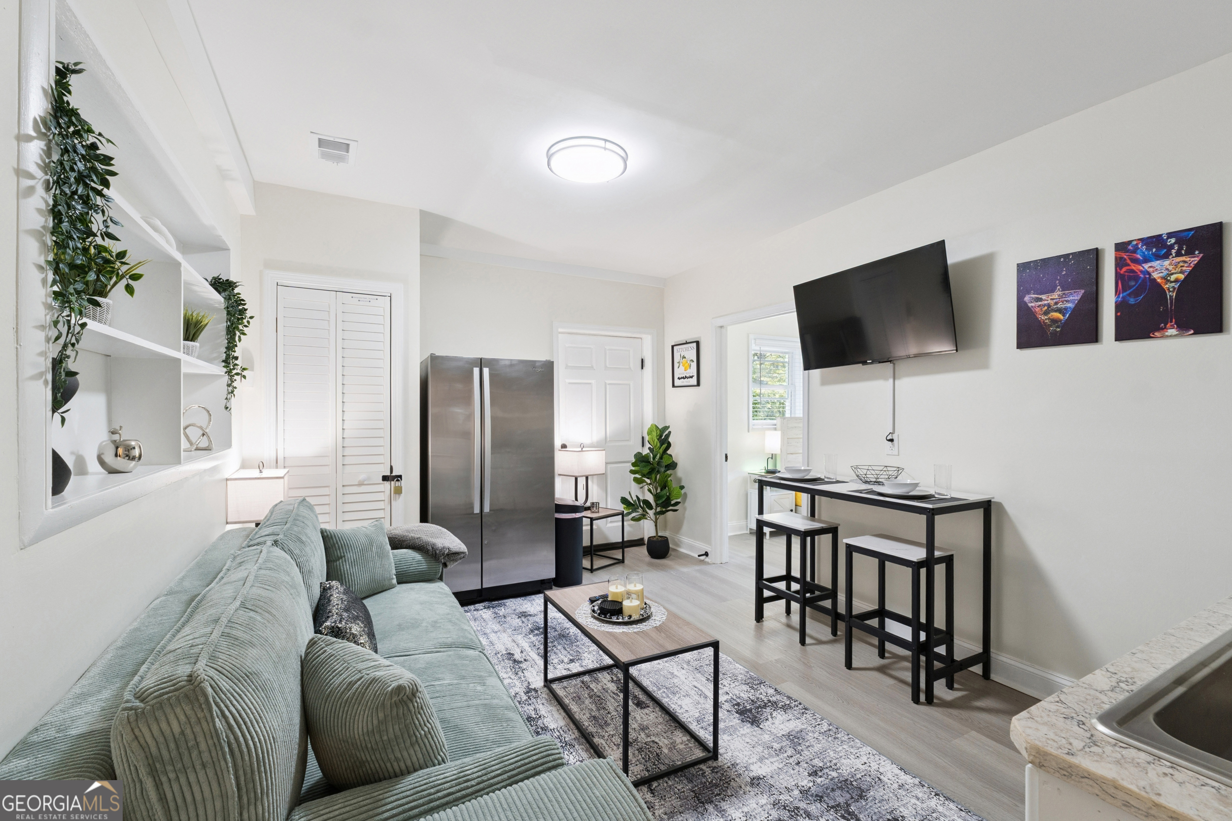2139 Cedarbrook Court Southeast Atlanta, GA 30316 - Photo 50 of 69 a living room with furniture and a flat screen tv