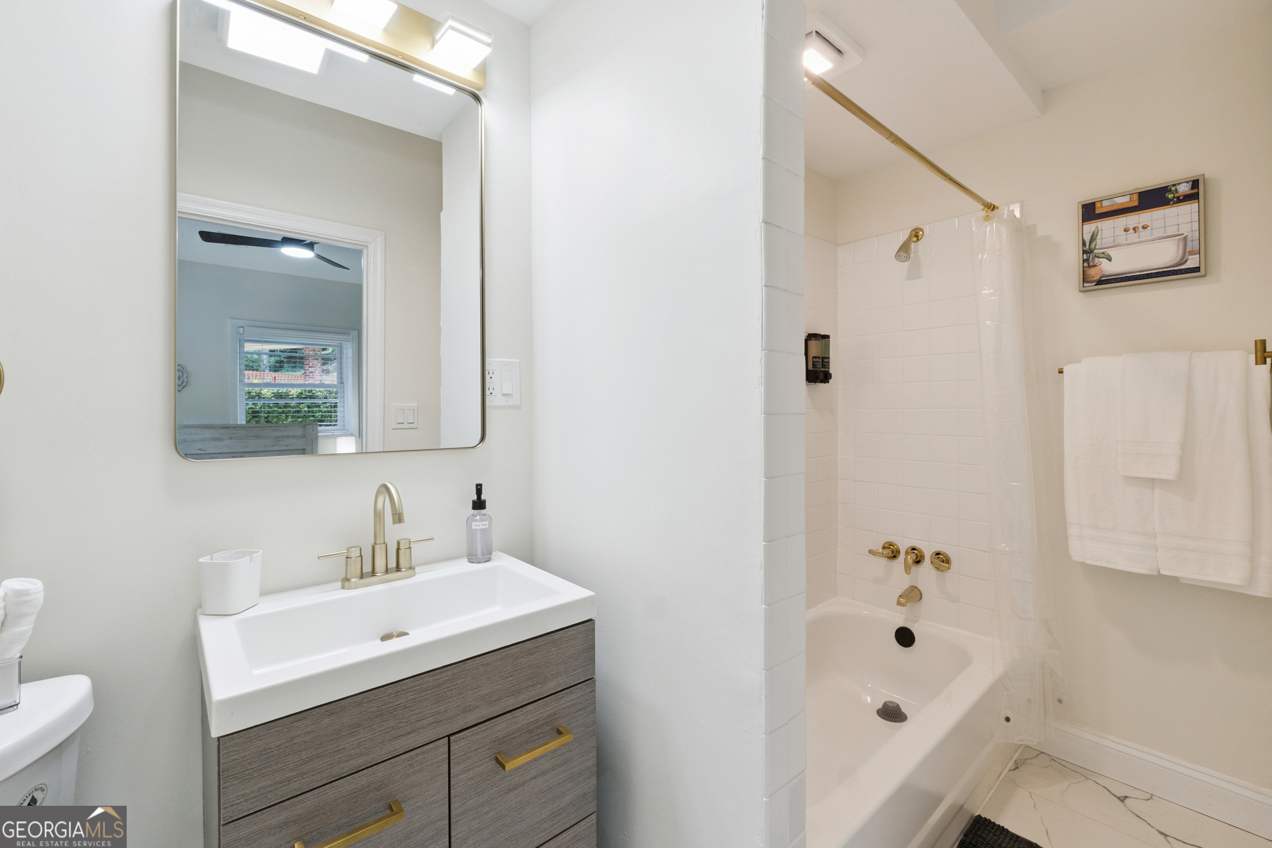 2139 Cedarbrook Court Southeast Atlanta, GA 30316 - Photo 57 of 69 a bathroom with a sink a toilet and shower