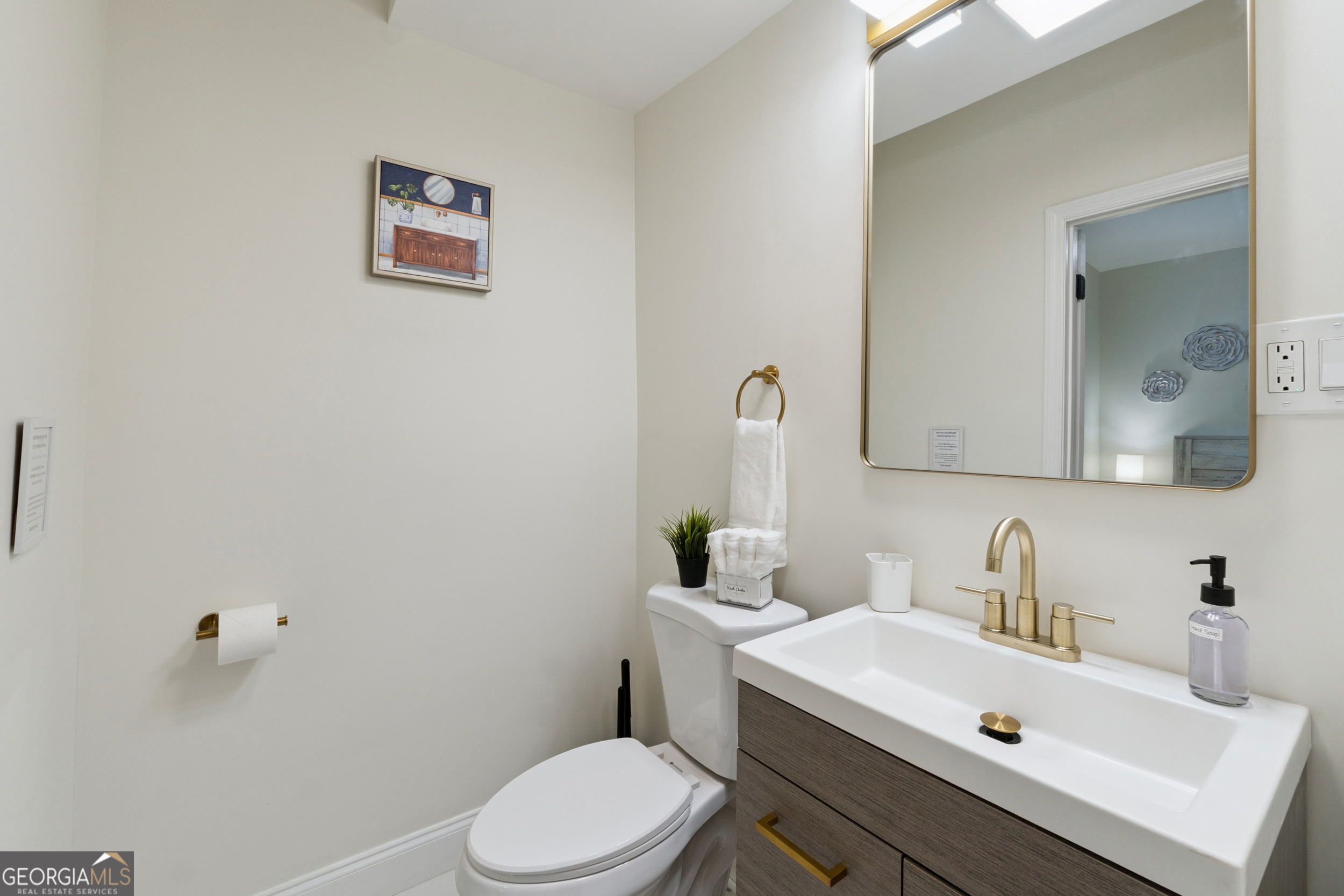 2139 Cedarbrook Court Southeast Atlanta, GA 30316 - Photo 58 of 69 a bathroom with a sink a toilet and a mirror