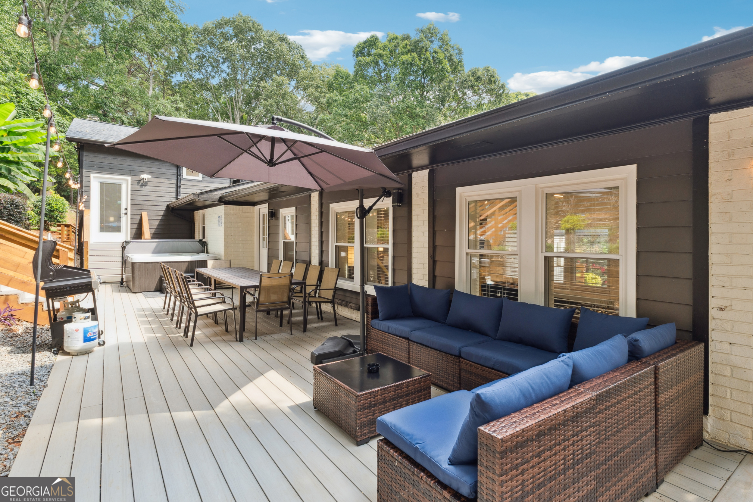 2139 Cedarbrook Court Southeast Atlanta, GA 30316 - Photo 61 of 69 a view of a patio with couches and table with wooden floor