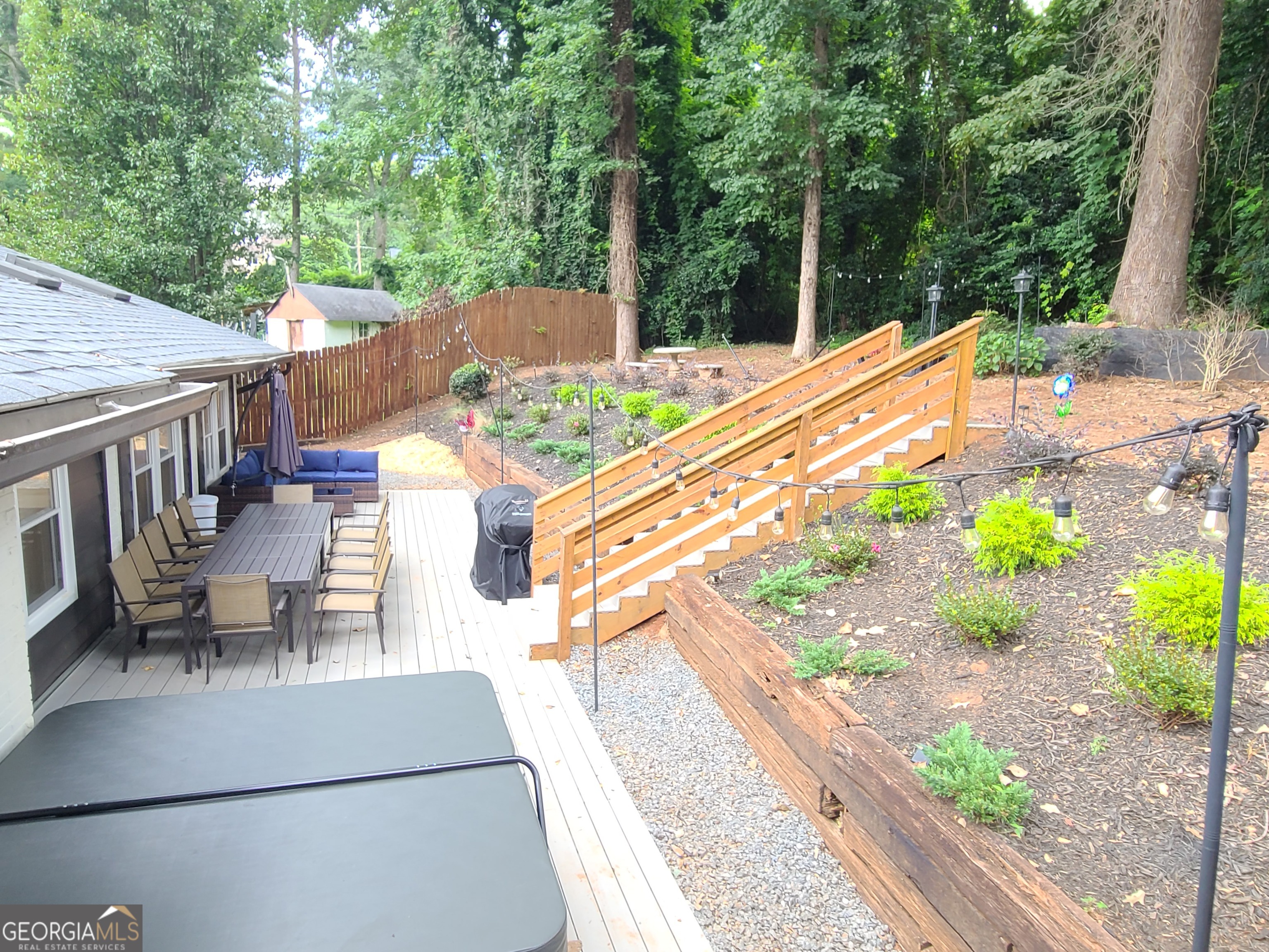 2139 Cedarbrook Court Southeast Atlanta, GA 30316 - Photo 69 of 69 a view of a patio with table and chairs potted plants with wooden floor