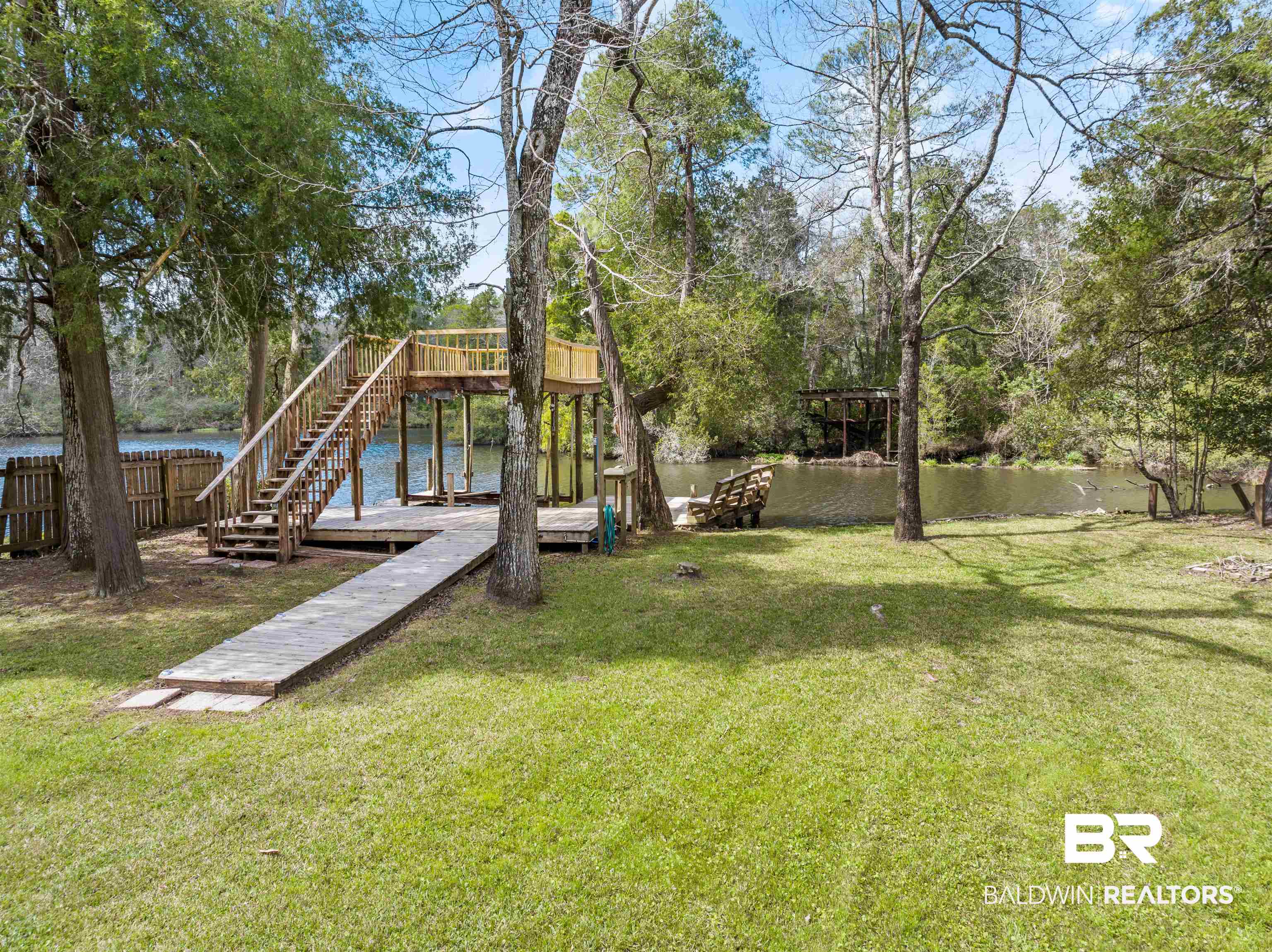 17595 River Road Summerdale, AL 36580 - Photo 26 of 29 View of yard with a water view and a dock