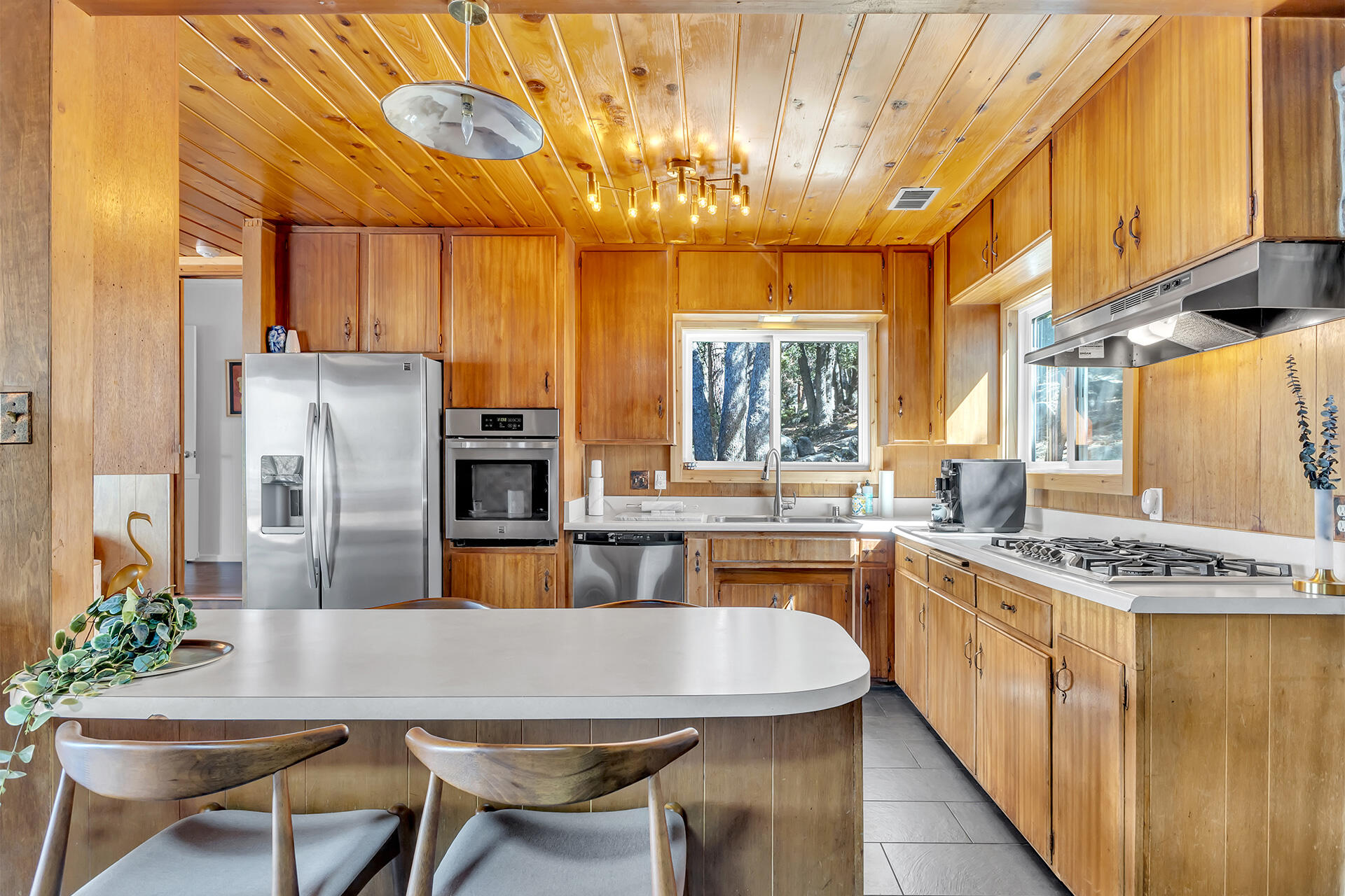 52300 Sylvan Way Idyllwild, CA 92549 - Photo 25 of 88 a kitchen with stainless steel appliances granite countertop a sink a stove and refrigerator