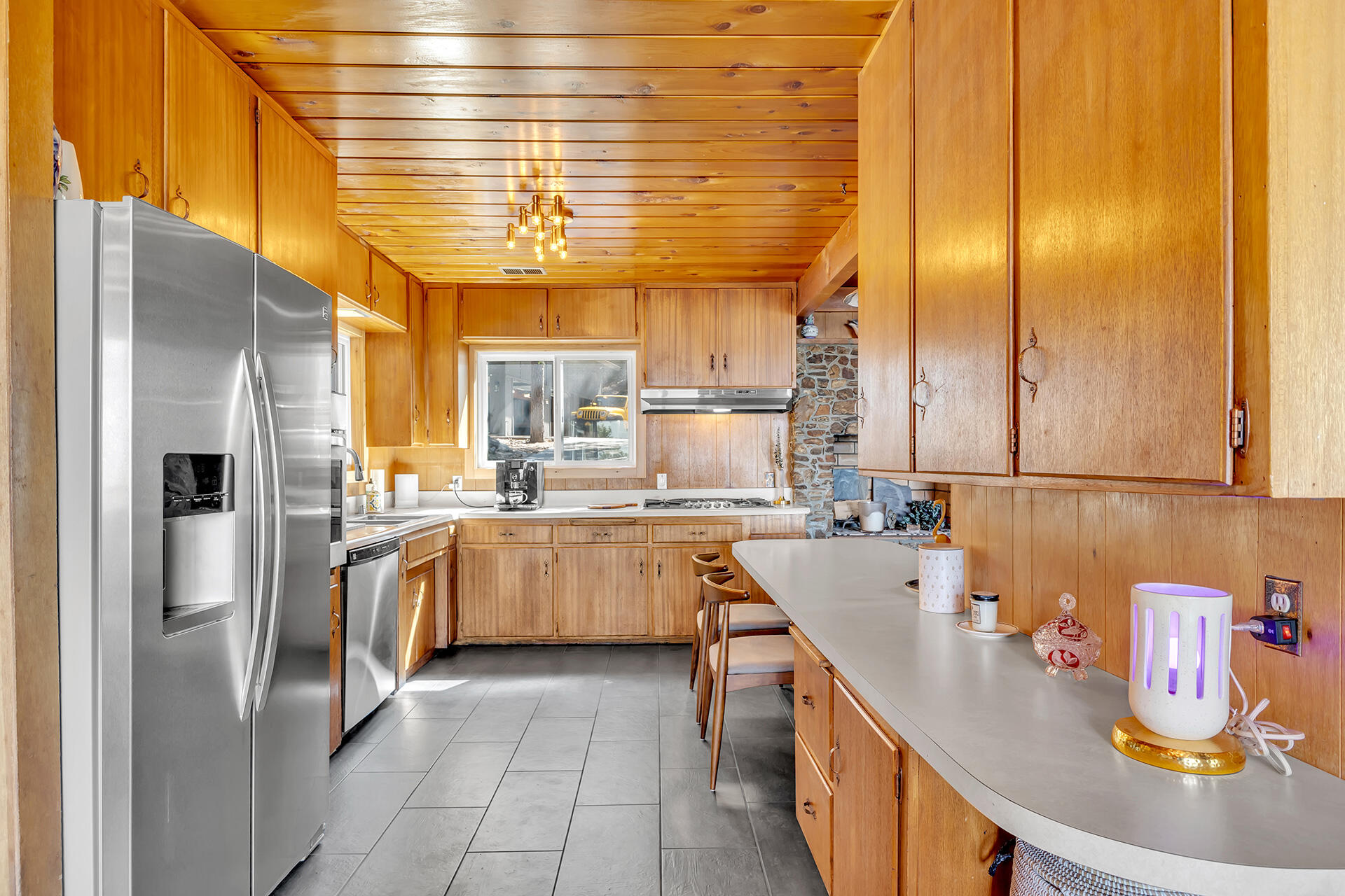 52300 Sylvan Way Idyllwild, CA 92549 - Photo 30 of 88 a kitchen with stainless steel appliances granite countertop a sink and a refrigerator