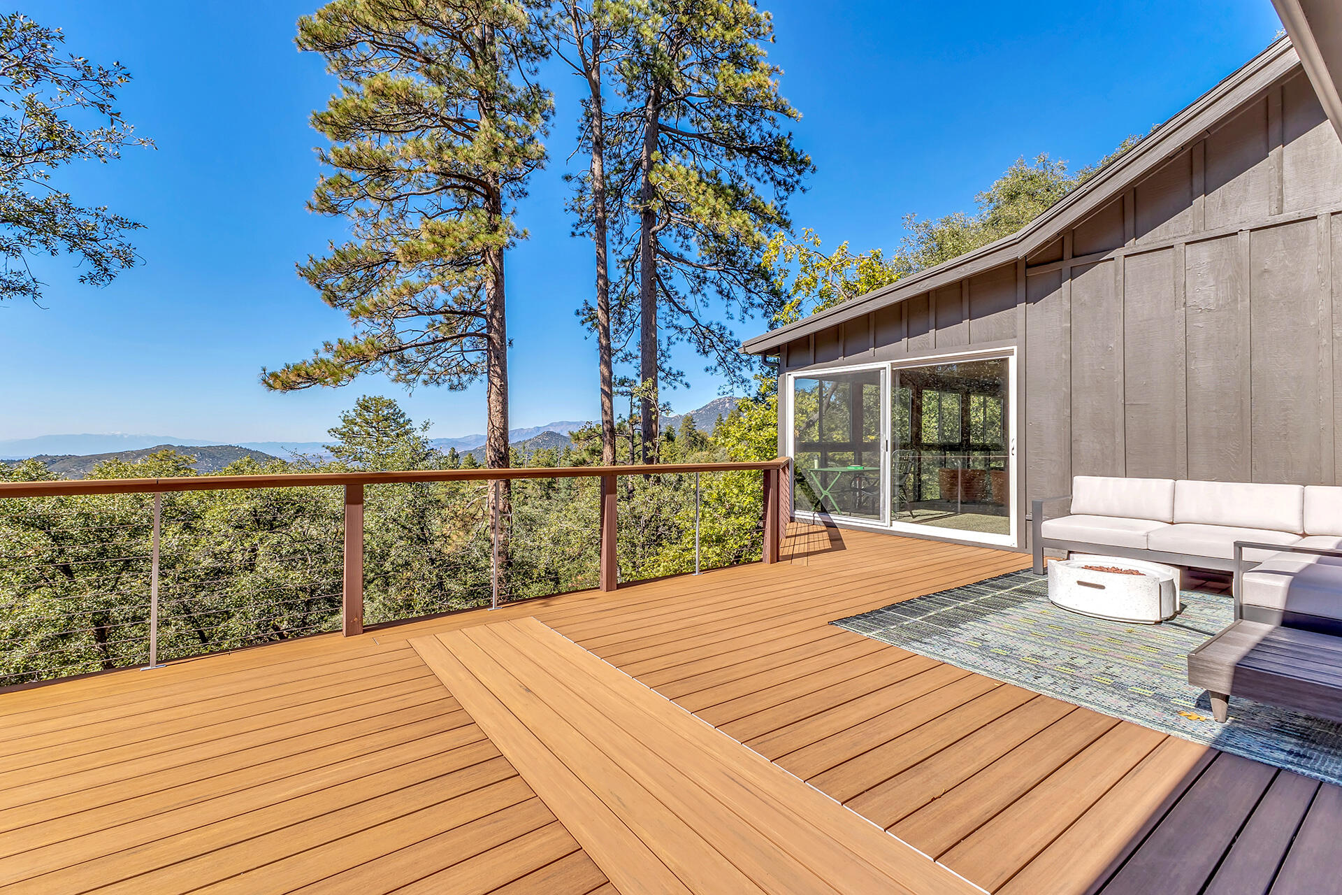 52300 Sylvan Way Idyllwild, CA 92549 - Photo 53 of 88 a view of a roof deck with wooden floor and fence