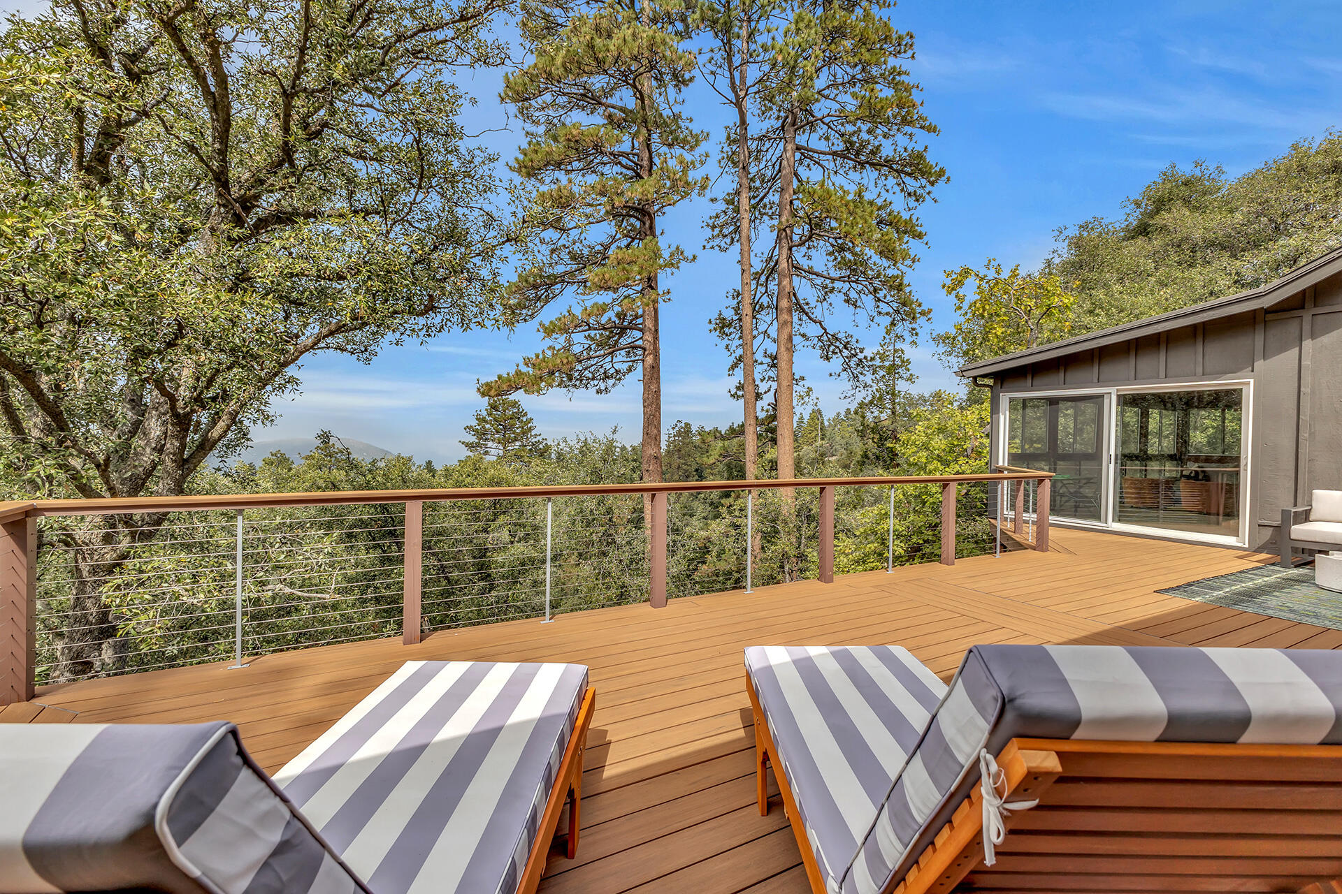 52300 Sylvan Way Idyllwild, CA 92549 - Photo 56 of 88 a view of balcony with wooden floor and outdoor seating