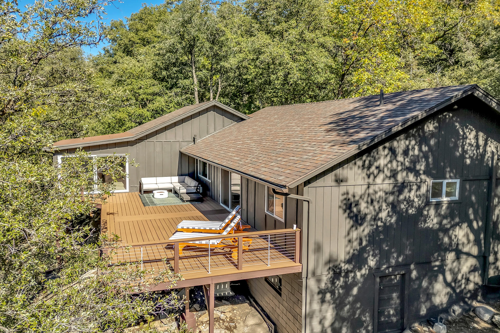 52300 Sylvan Way Idyllwild, CA 92549 - Photo 59 of 88 a view of a patio with table and chairs with wooden fence and plants