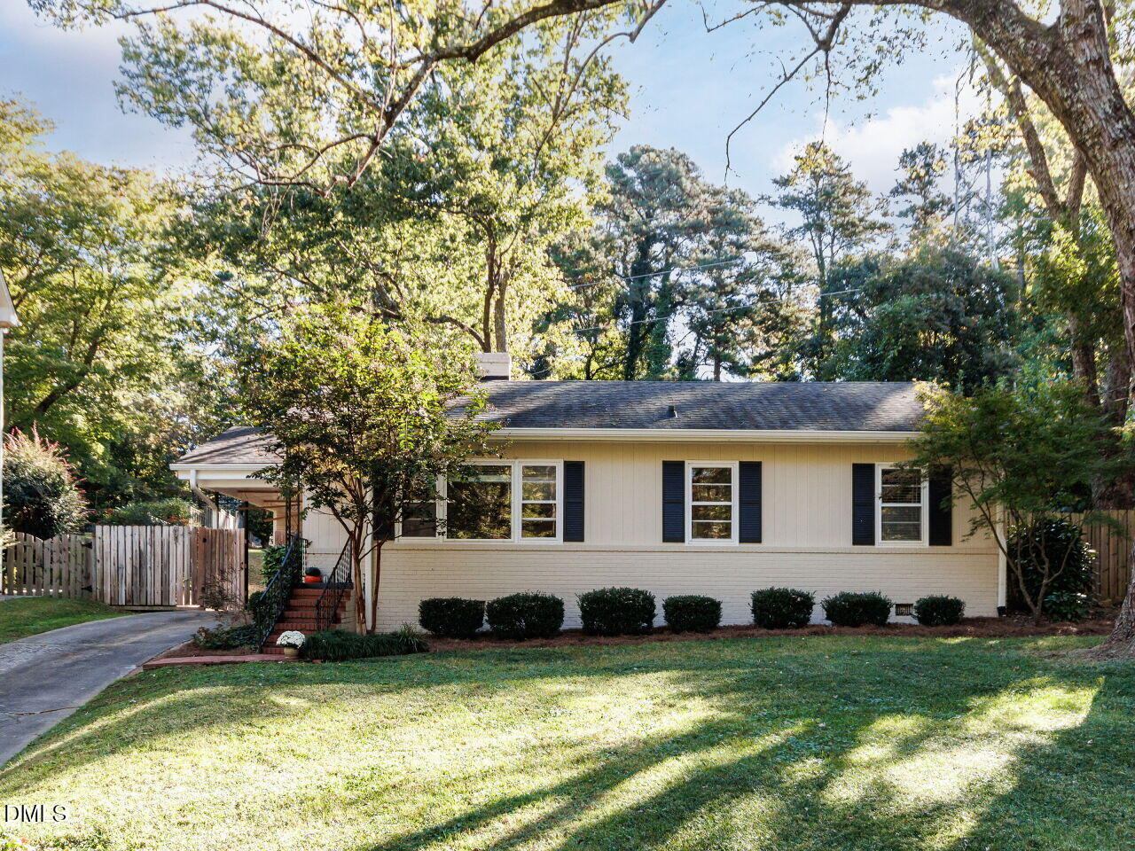 a view of a house with a yard and sitting area