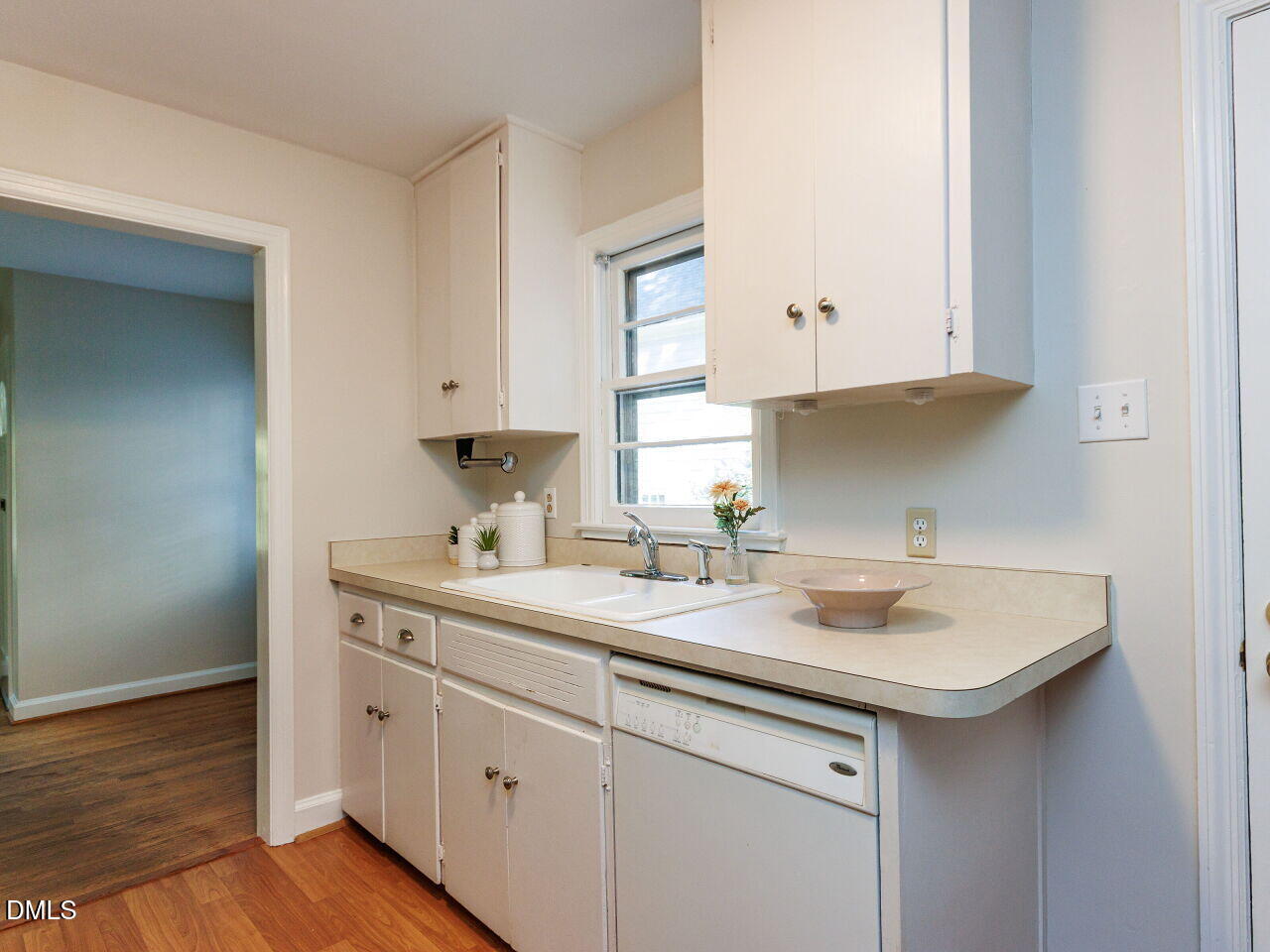 1332 Banbury Road Raleigh, NC 27607 - Photo 14 of 46 a kitchen with a sink and cabinets