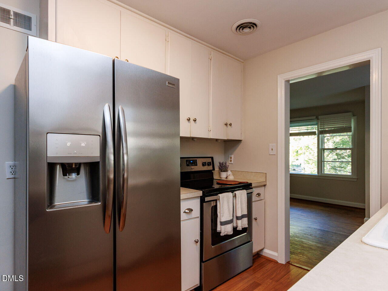 1332 Banbury Road Raleigh, NC 27607 - Photo 15 of 46 a kitchen with stainless steel appliances granite countertop a refrigerator and a stove