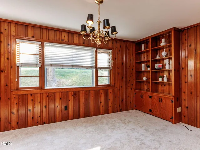 a kitchen with stainless steel appliances granite countertop a refrigerator and a stove