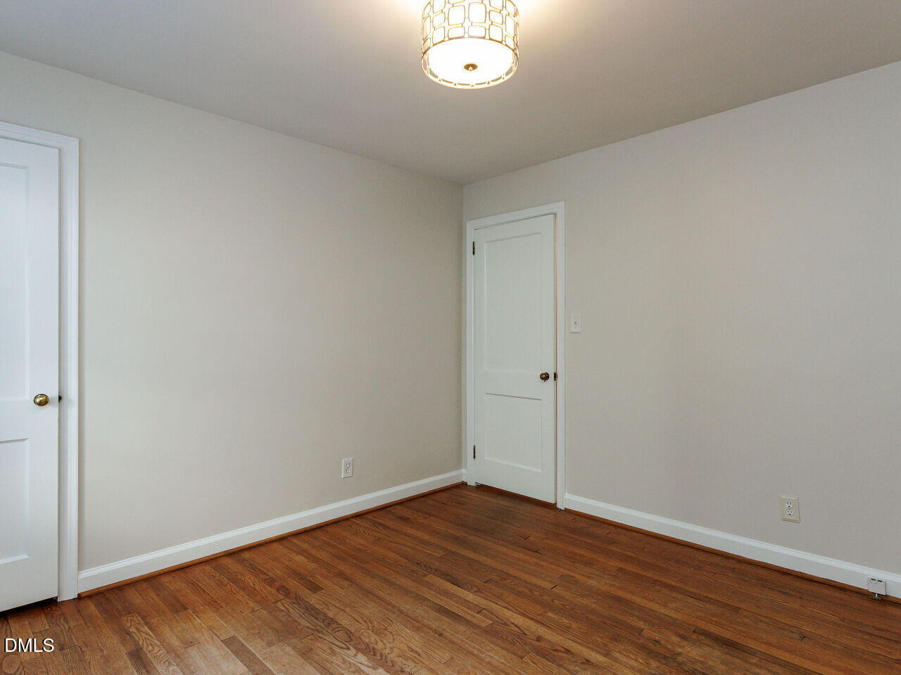 1332 Banbury Road Raleigh, NC 27607 - Photo 21 of 46 wooden floor in an empty room