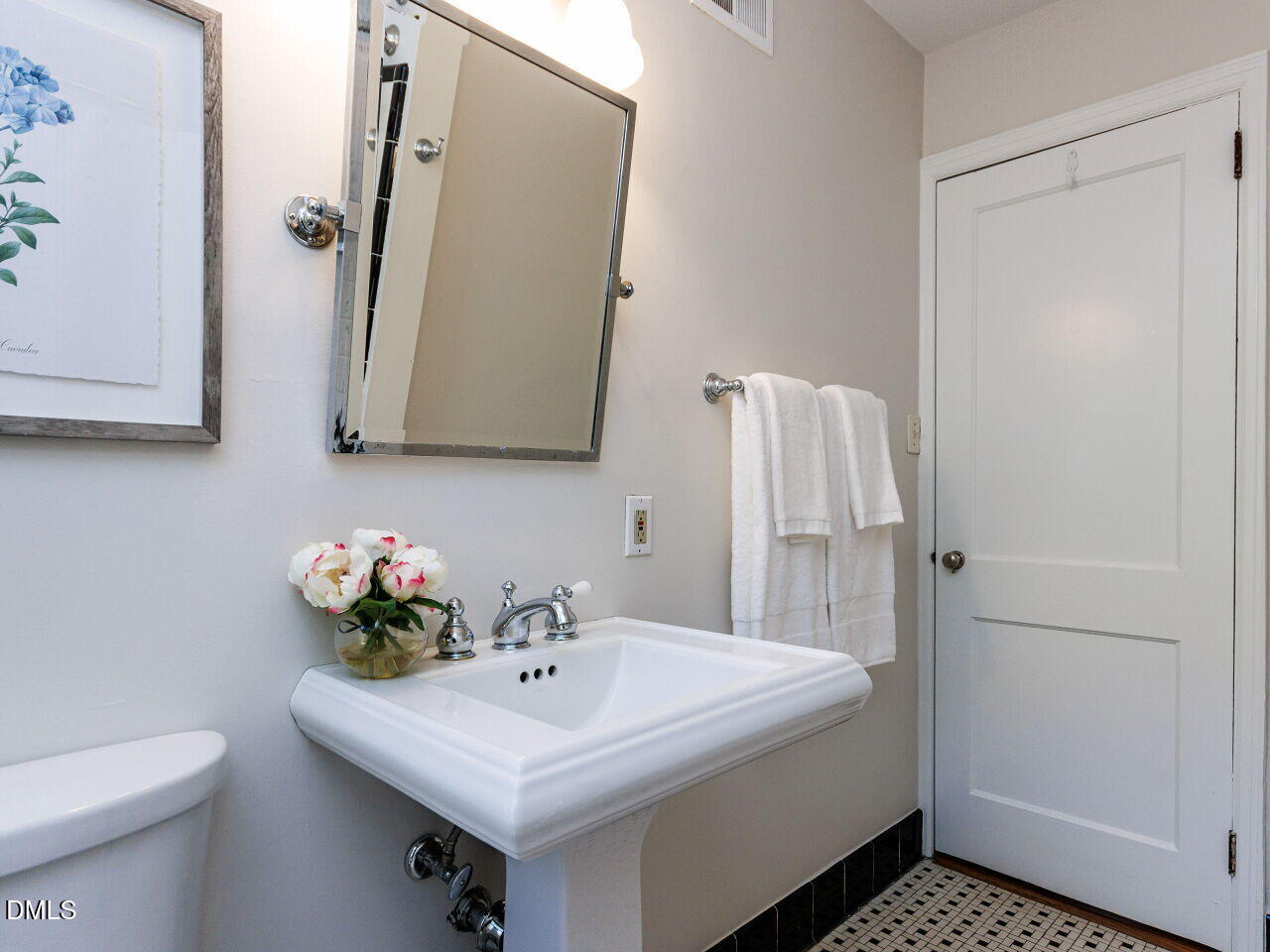 1332 Banbury Road Raleigh, NC 27607 - Photo 22 of 46 a bathroom with a sink toilet and mirror