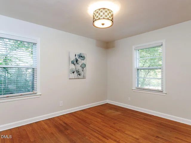 a living room with a couch and a window