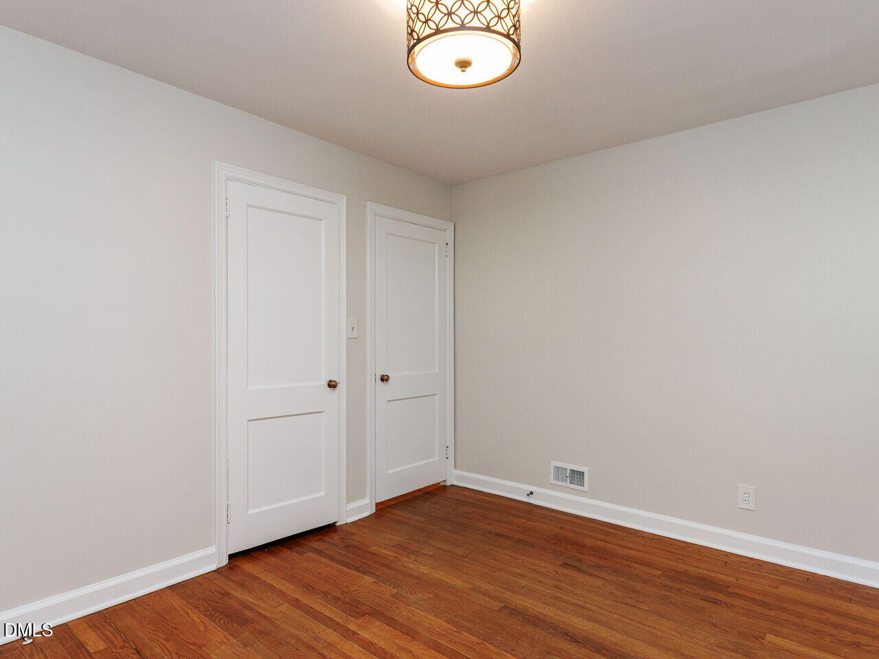 1332 Banbury Road Raleigh, NC 27607 - Photo 25 of 46 a view of empty room with wooden floor