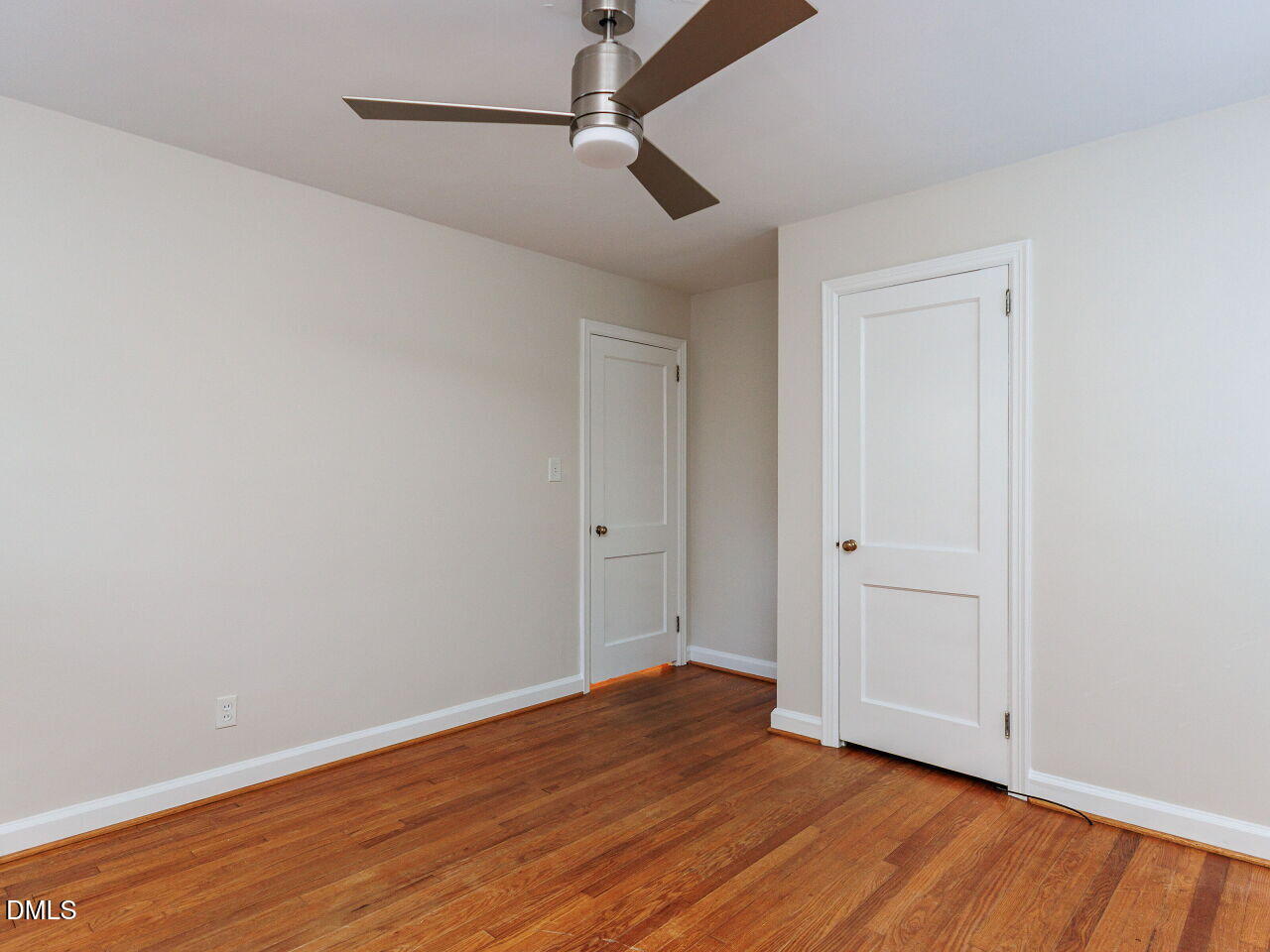 1332 Banbury Road Raleigh, NC 27607 - Photo 28 of 46 a view of an empty room with wooden floor