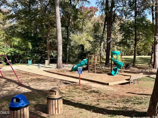 a view of a park with large trees