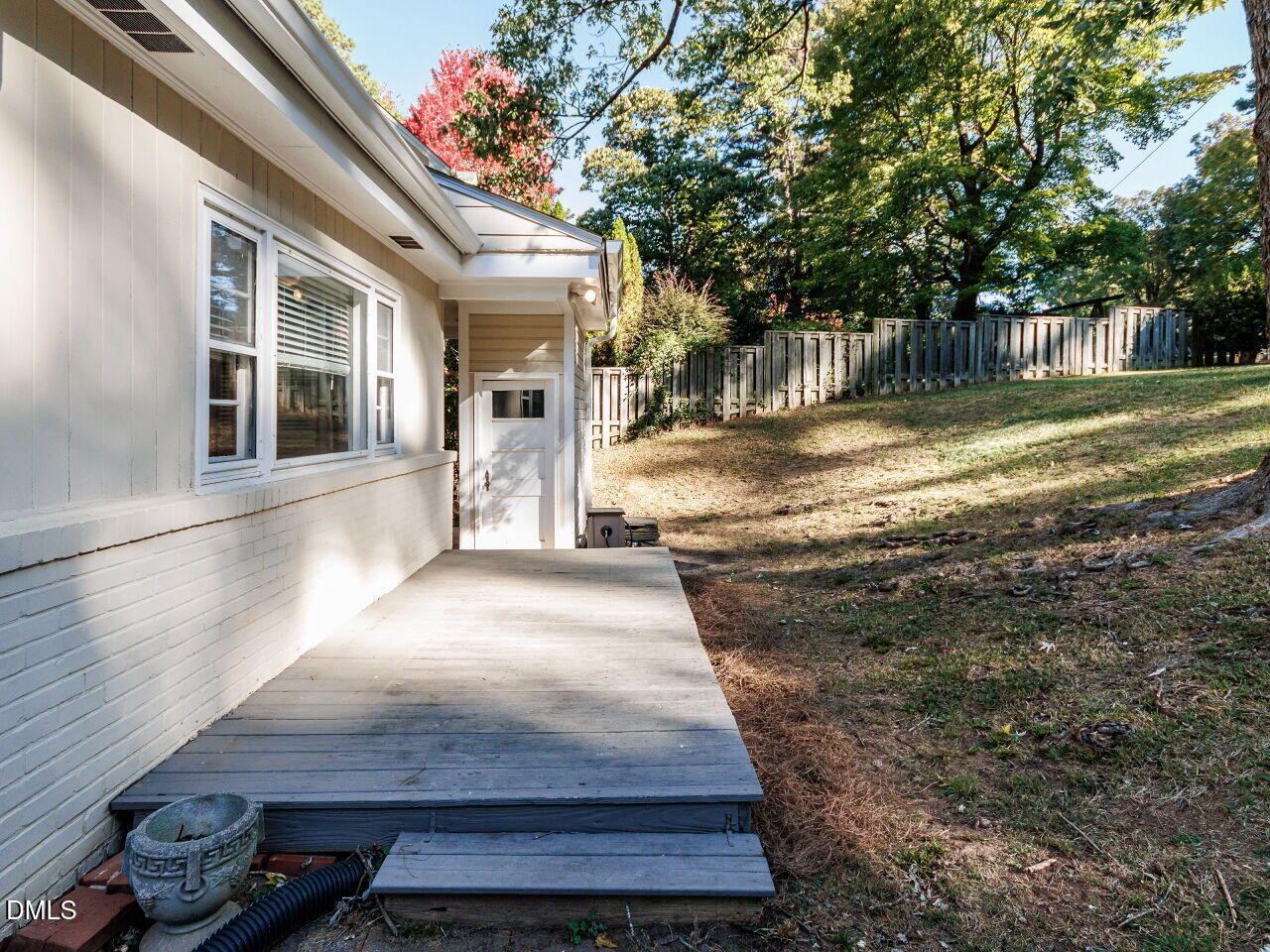 1332 Banbury Road Raleigh, NC 27607 - Photo 32 of 46 a view of a house with backyard and sitting area