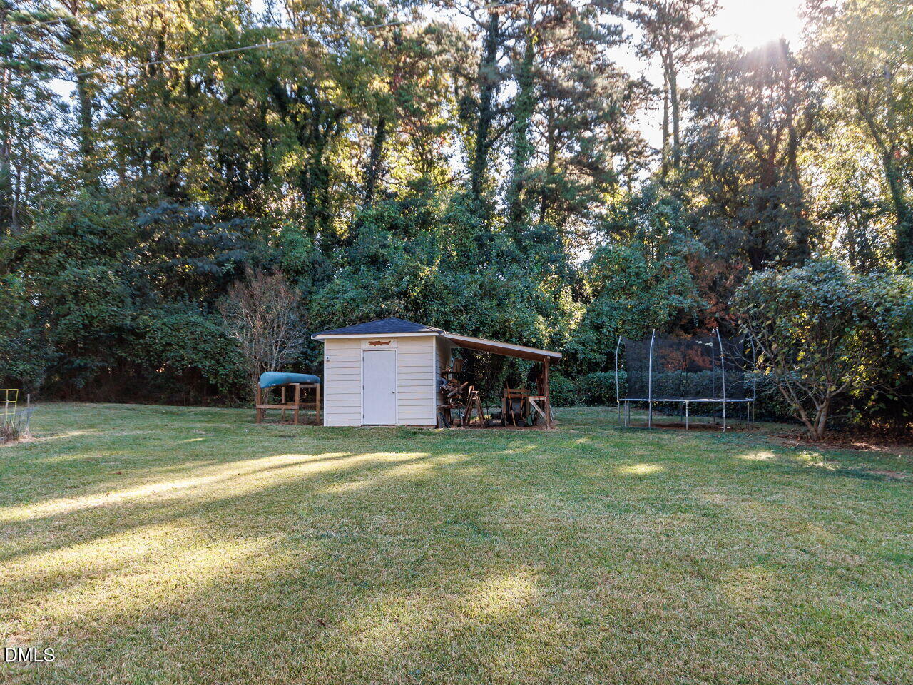 1332 Banbury Road Raleigh, NC 27607 - Photo 37 of 46 a view of a big yard with basketball court