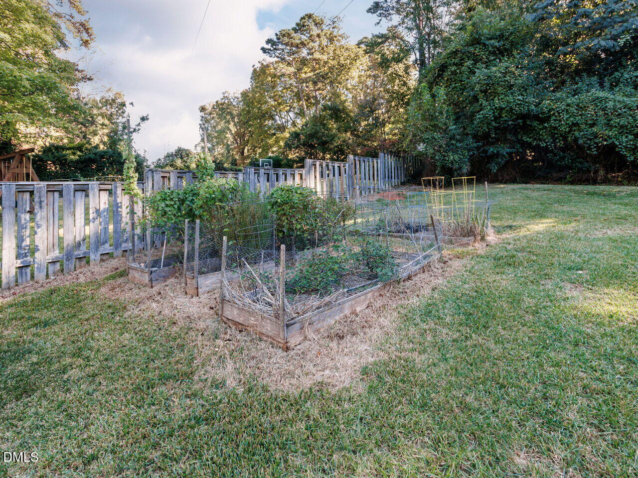 1332 Banbury Road Raleigh, NC 27607 - Photo 39 of 46 a backyard of a house with lots of green space