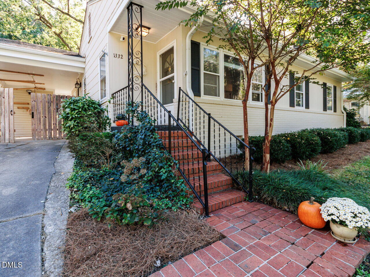 1332 Banbury Road Raleigh, NC 27607 - Photo 3 of 46 a view of a house with a yard and a garden