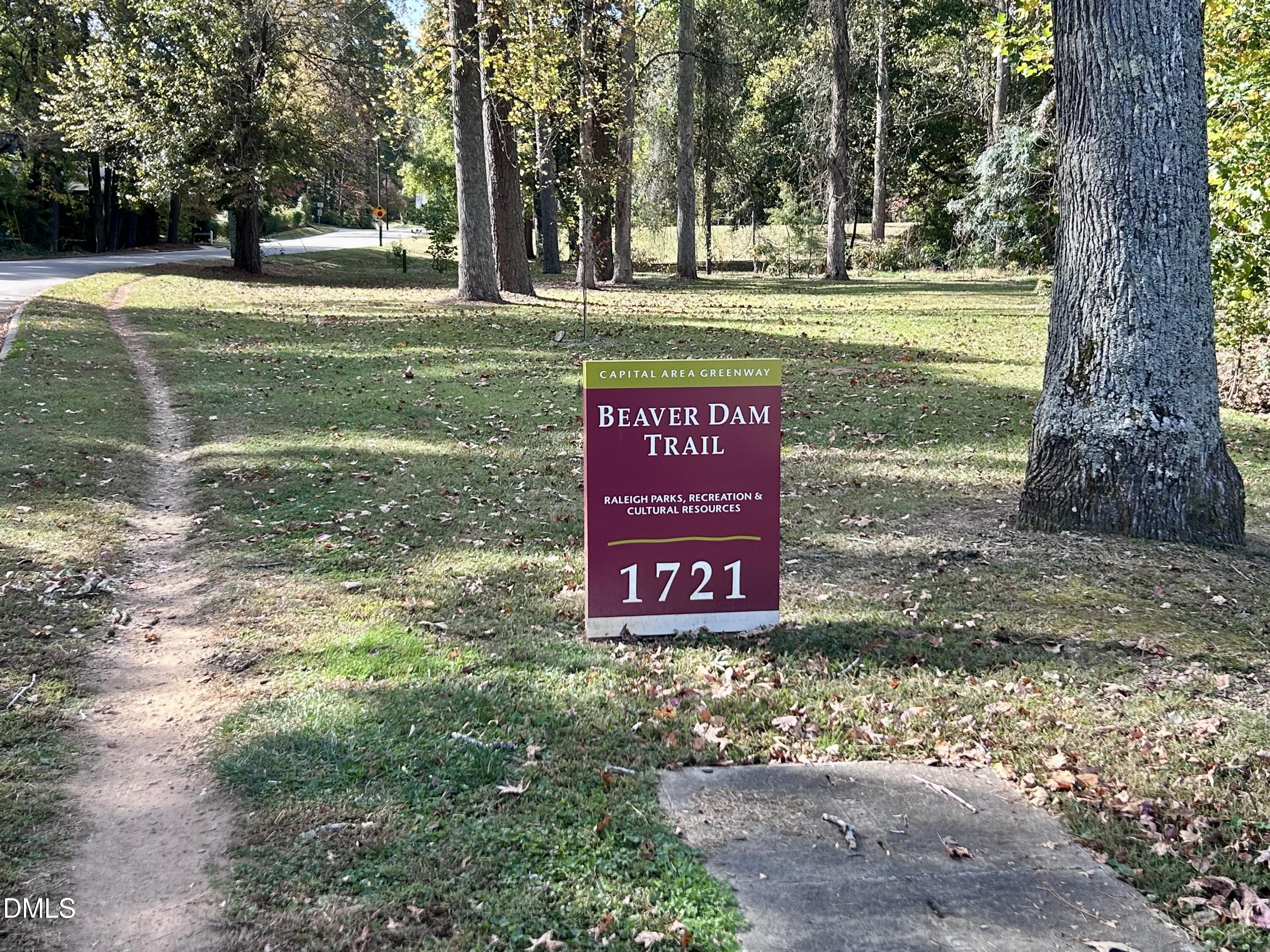 1332 Banbury Road Raleigh, NC 27607 - Photo 5 of 46 a sign that is sitting in the middle of a yard