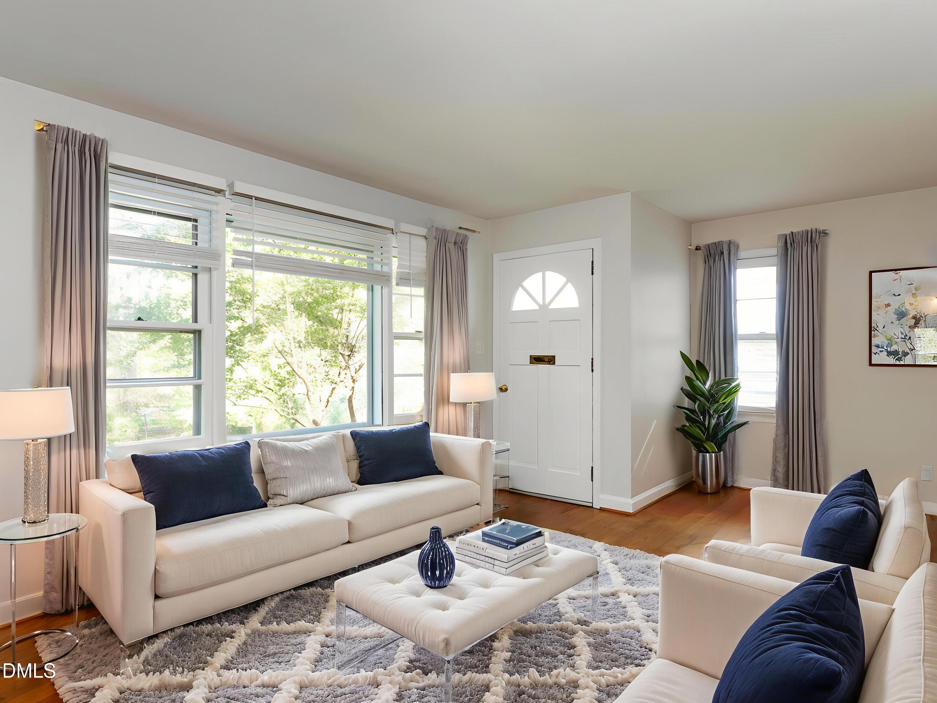 1332 Banbury Road Raleigh, NC 27607 - Photo 9 of 46 a living room with furniture and a large window