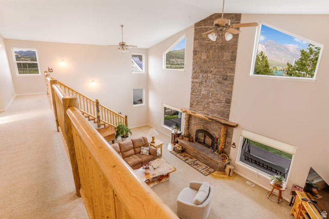 48 South Sage Road Pine Valley, UT 84781 - Photo 37 of 61 Two-story living area featuring a floor-to-ceiling stone-clad fireplace and a wood mantel