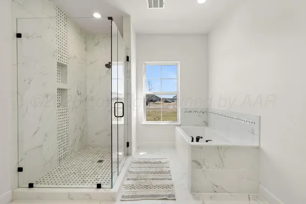 a bathroom with a bathtub and a window