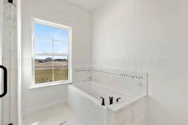 a bathroom with double vanity sink and mirror