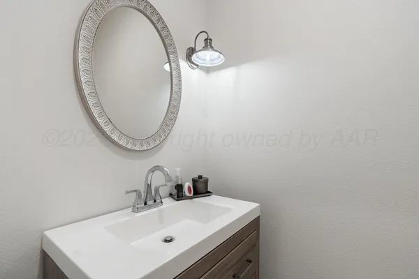 a bedroom with a bed couch and a window