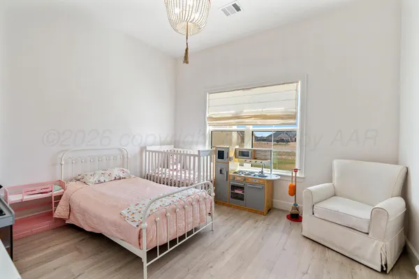 a bedroom with furniture and a window