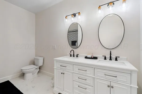 a bathroom with a sink and a shower