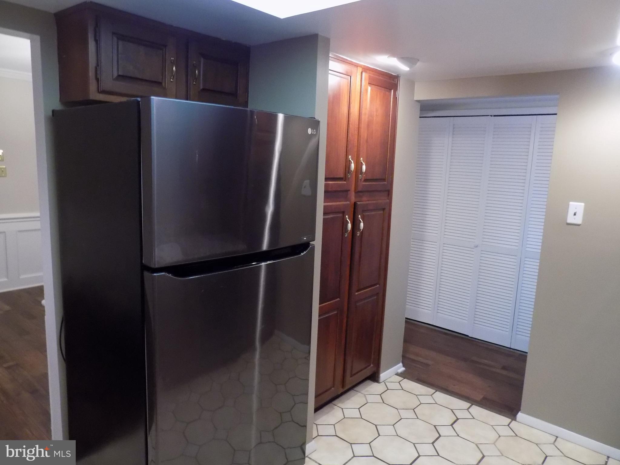 702 Towne Center Drive Joppa, MD 21085 - Photo 14 of 45 a metallic refrigerator freezer sitting in a kitchen