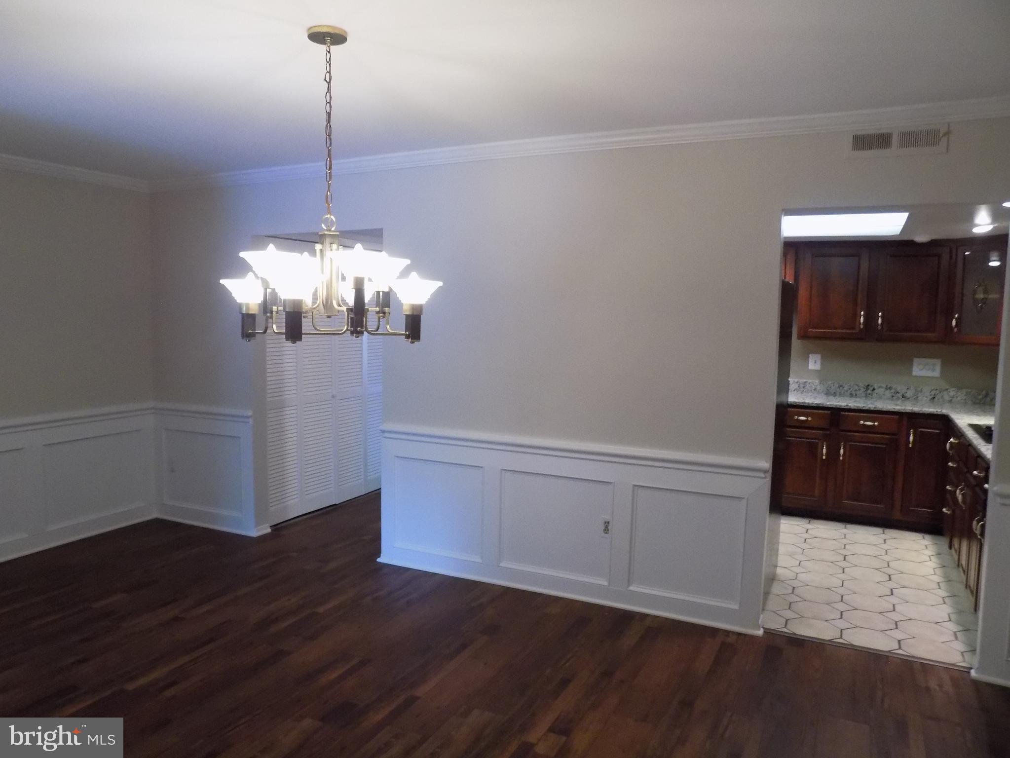 702 Towne Center Drive Joppa, MD 21085 - Photo 17 of 45 a view of a kitchen sink and wooden floor