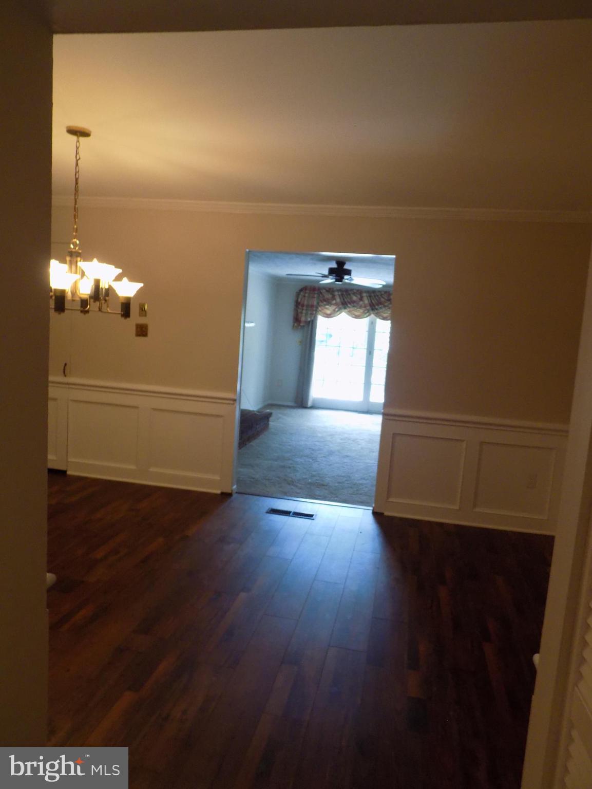 702 Towne Center Drive Joppa, MD 21085 - Photo 18 of 45 a view of a livingroom with wooden floor