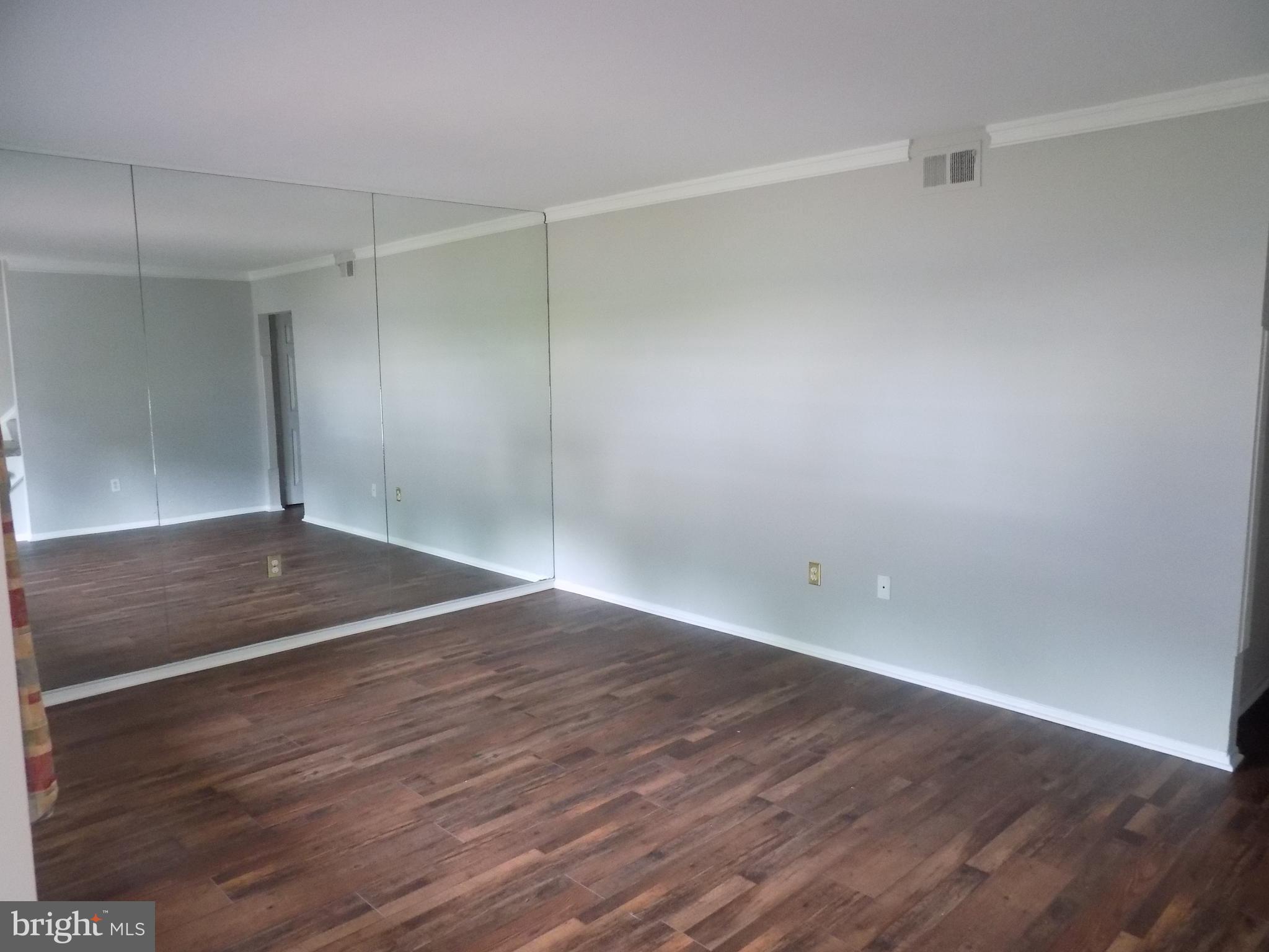 702 Towne Center Drive Joppa, MD 21085 - Photo 2 of 45 a view of a room with wooden floor